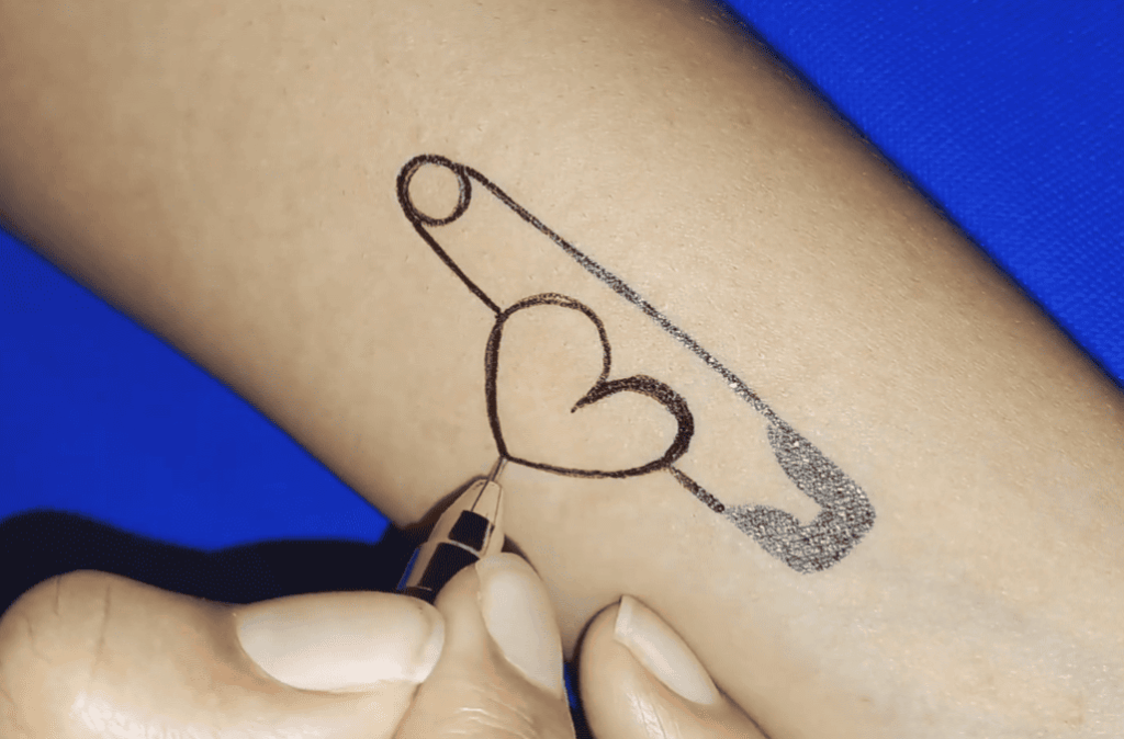 Historical Roots and Symbolism of Safety Pin Tattoos